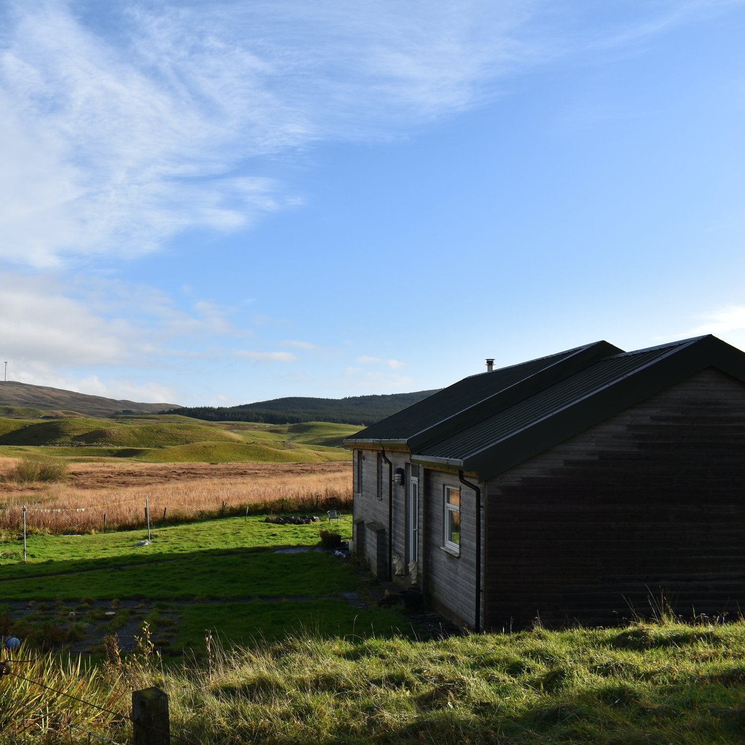 Off-grid timber house on rural Scottish moorland at Loch Walton