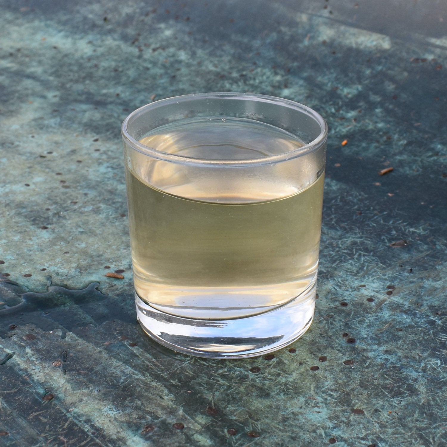 Glass of yellow-tinted untreated loch water