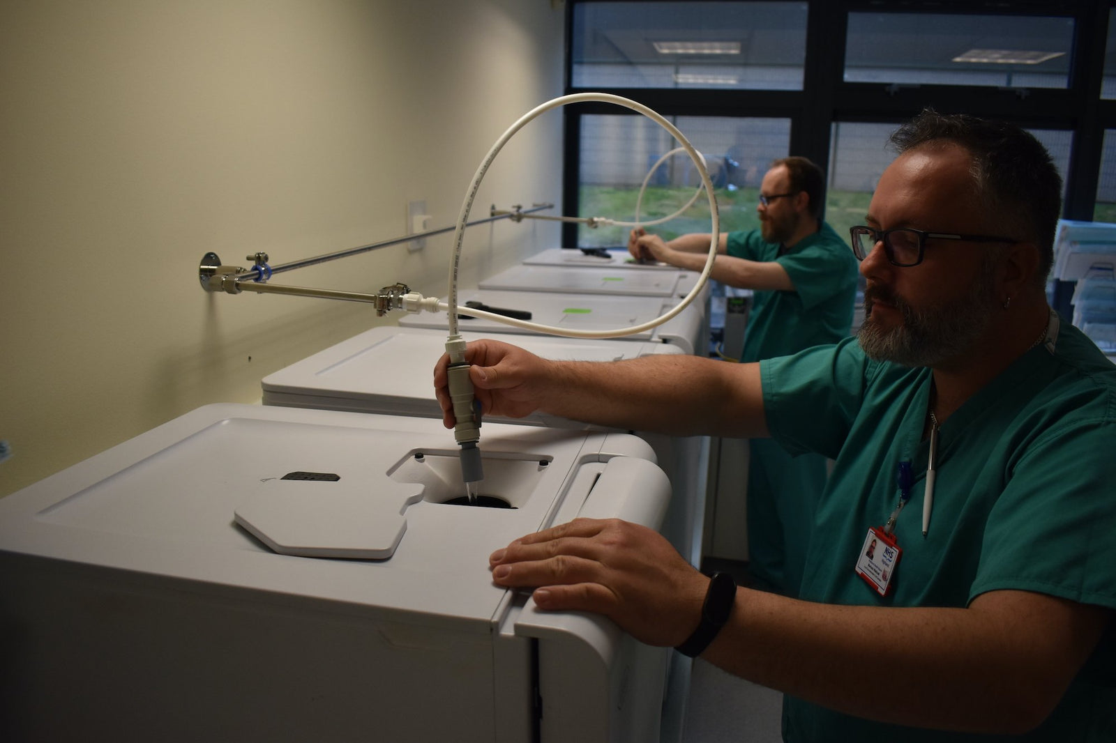 Decontamination technicians filling autoclaves with MedicalOne purified water